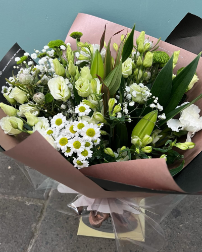 Evelyn - A fabulous collection of white and cream flowers make this the perfect gift. This bouquet will be hand delivered by the local florist.