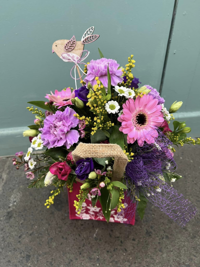 A Little Something - Show your affection with this mouth-watering mix of classical flowers delivered in a delightful gift bag or box.