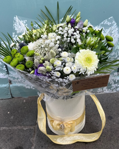 Simply The Best - A beautiful hat-box filled with a vibrant collection of flowers and foliage.